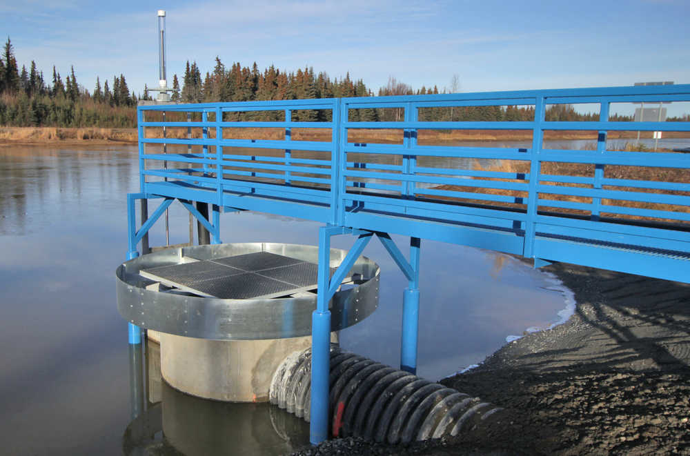 Photo by Ben Boettger/Peninsula Clarion A new drainage outlet holds the Kenai Municipal Airport floatplane pond to its winter level of about 4 feet on Thursday, Nov. 3 in Kenai, Alaska. When filled to its summer level, the upper grate, surrounded by a ring-shaped barrier, will prevent it from overflowing.