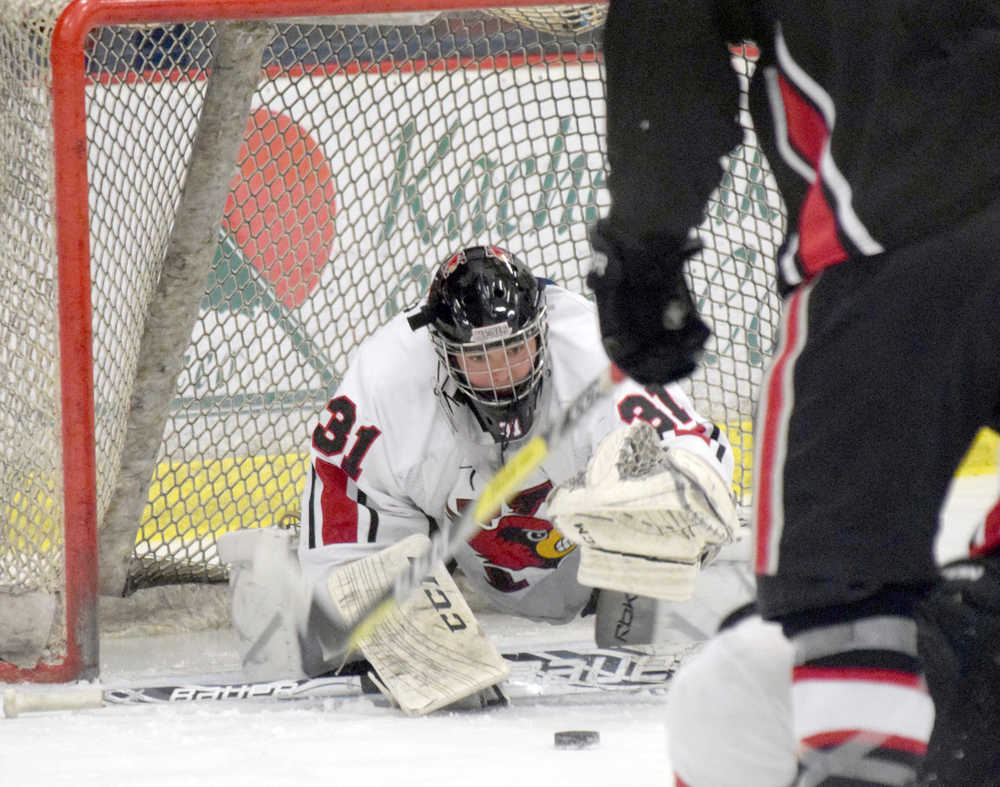 Photo by Jeff Helminiak/Peninsula Clarion Kenai Central goalie Ryan Williams makes a save Friday against Houston at the Soldotna Regional Sports Complex during the Peninsula Ice Challenge.