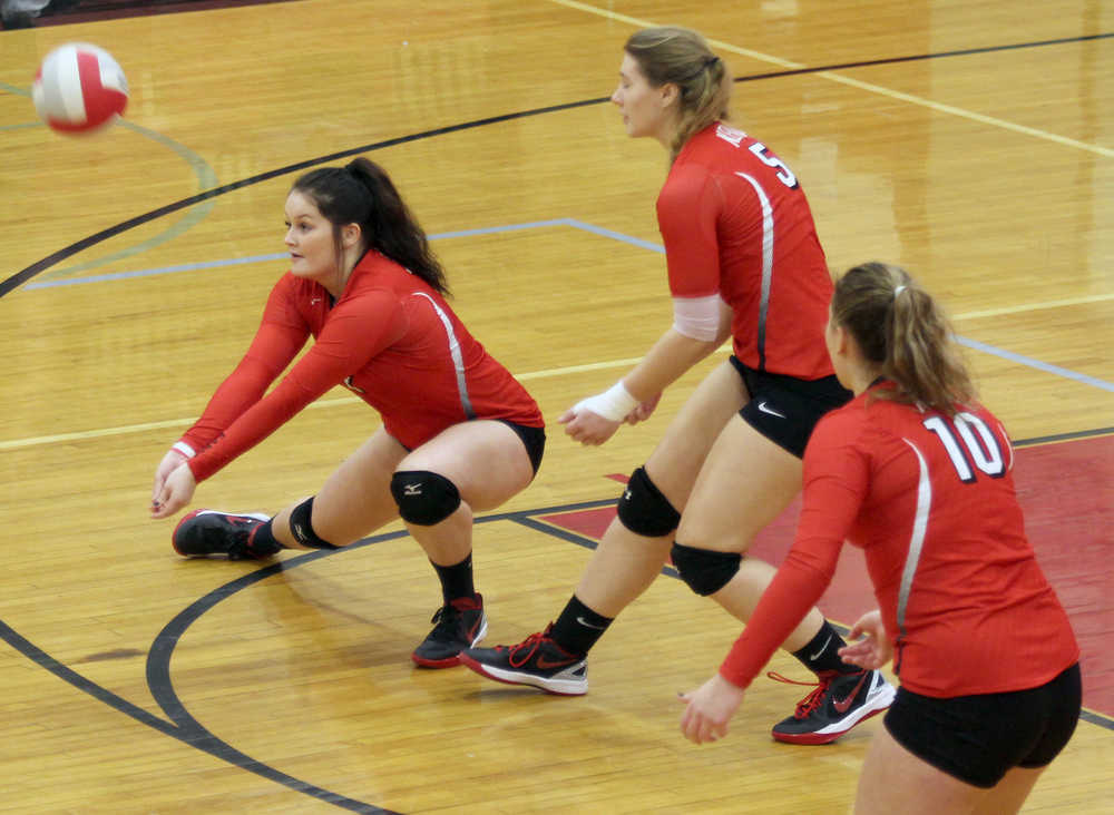 Kenai Central senior Jill Kindred receives a serve during a 3-0 loss to Wasilla Friday, the second day of the Northern Lights Conference Championships at Wasilla High School. Kenai upset Soldotna earlier in the day, but was eliminated with the loss to host Wasilla.