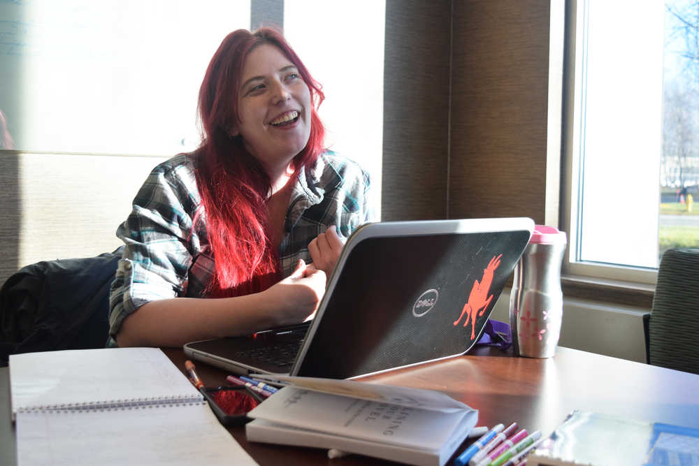 Photo by Megan Pacer/Peninsula Clarion Soldotna resident Leslie Meyer smiles as she speaks about her project for this year's National Novel Writing Month on Saturday, Nov. 5, 2016 at the Joyce K. Carver Memorial Library in Soldotna, Alaska. The worldwide creative writing challenge kicks off at the beginning of November and asks participants to write 50,000 words in 30 days. The library in Soldotna will host writing days each Saturday where participants can get together to work and share ideas.