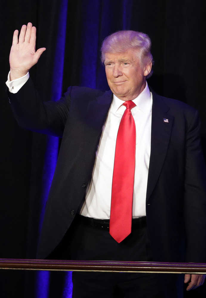 President-elect Donald Trump waves as he arrives at his election night rally, Wednesday, Nov. 9, 2016, in New York. (AP Photo/John Locher)