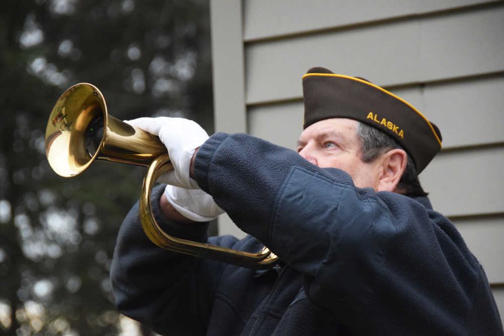 Photo by Megan Pacer/Peninsula Clarion Lee Miller performs taps following a gun salute by the Kenai VFW Post