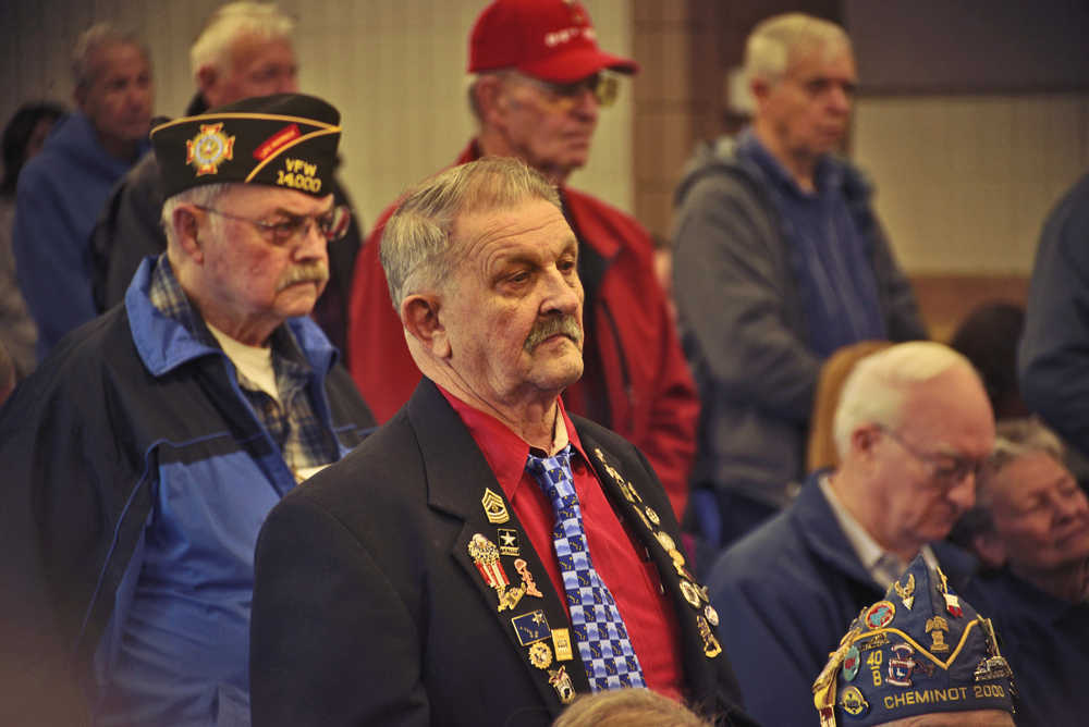 Photo by Ben Boettger/Peninsula Clarion Local U.S Army veterans stand during a recitation of the Army's Soldier's Creed during a Veteran's Day Ceremony at the Soldotna Regional Sports Complex on Friday, Nov. 11 2016 in Soldotna, Alaska.