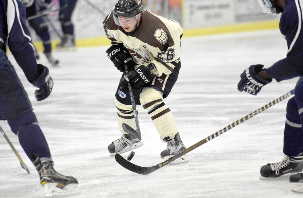 Photo by Jeff Helminiak/Peninsula Clarion Kenai River forward Jonathan Marzec looks for a hole in the Janesville (Wisconsin) Jets defense Friday at the Soldotna Regional Sports Complex.