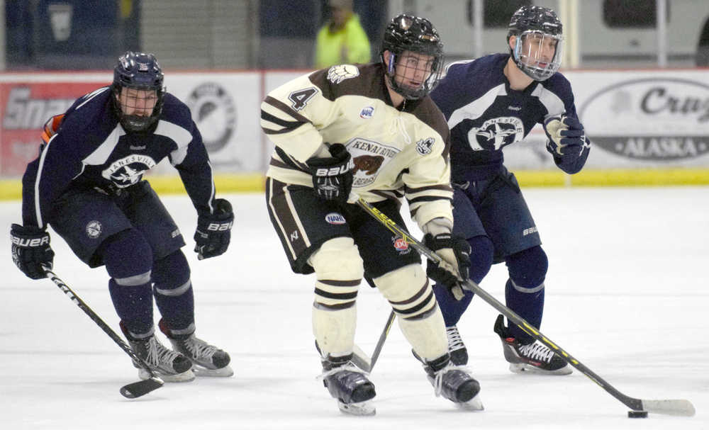Photo by Jeff Helminiak/Peninsula Clarion Kenai River's Matthew Thielemann looks to make a play as he crosses center ice Friday at the Soldotna Regional Sports Complex.