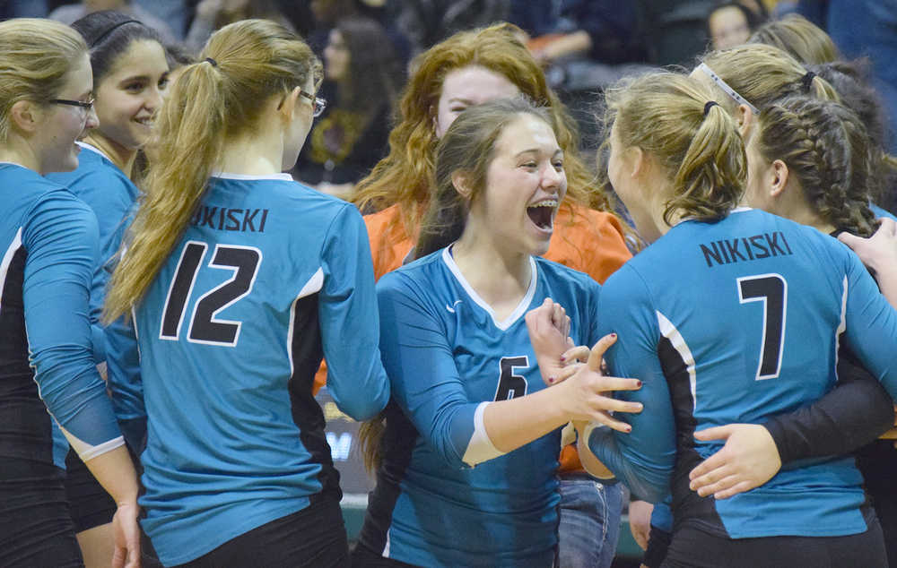 Photo by Joey Klecka/Peninsula Clarion Nikiski sophomore Emma Wik celebrates a semifinal win over Mt. Edgecumbe with her teammates Friday at the Class 3A state volleyball tournament at the Alaska Airlines Arena in Anchorage.