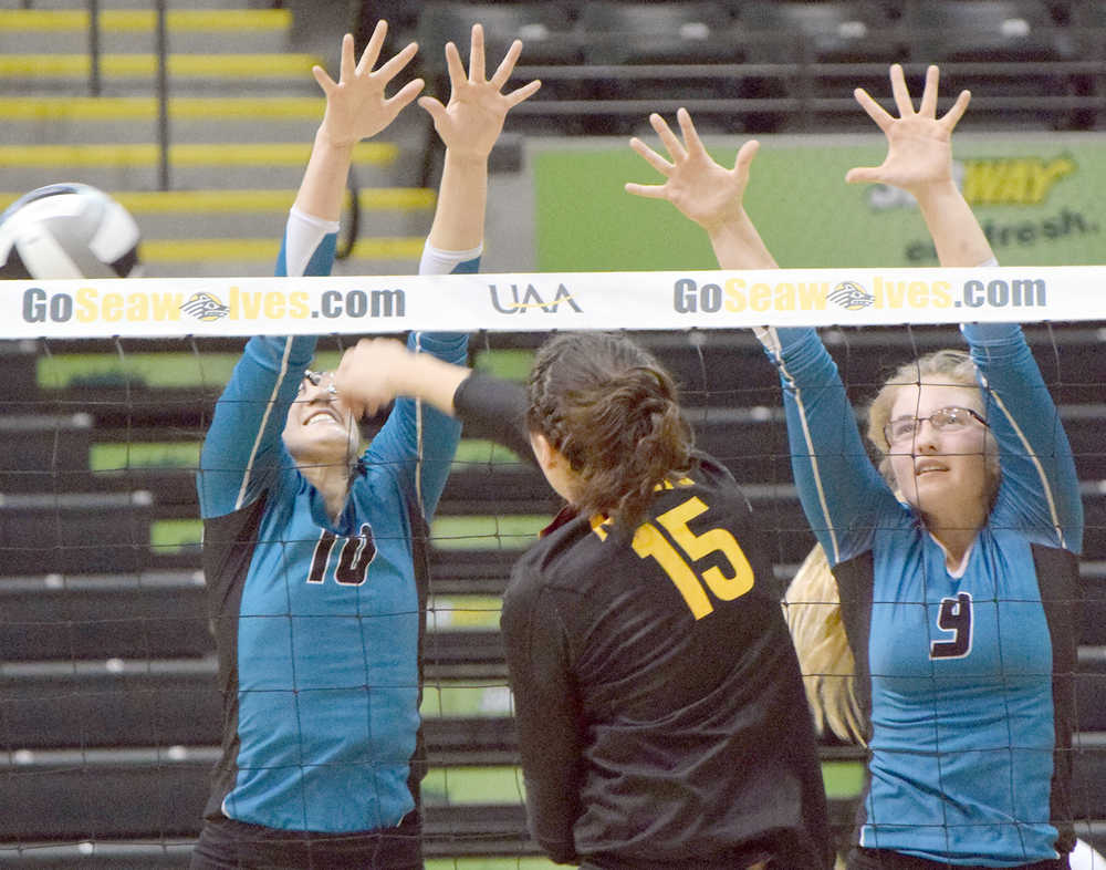 Photo by Joey Klecka/Peninsula Clarion Nikiski's Ayla Pitt (10) and Jamie Yerkes team up to block a shot by Mt. Edgecumbe hitter Haylee Steffes (15) Friday evening at the Class 3A state volleyball tournament held at the Alaska Airlines Arena in Anchorage.