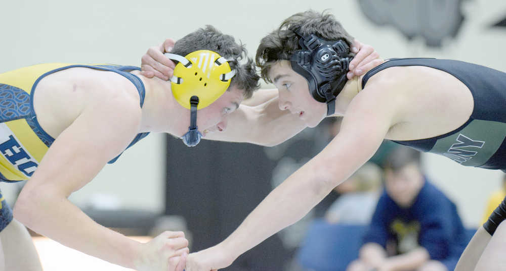 Photo by Jeff Helminiak/Peninsula Clarion Homer's Chris Cudaback and Colony's Eric Christy face off at 152 pounds Saturday in the championship dual at the Peninsula Duals at Nikiski High School. Christy notched a 3-1 decision.