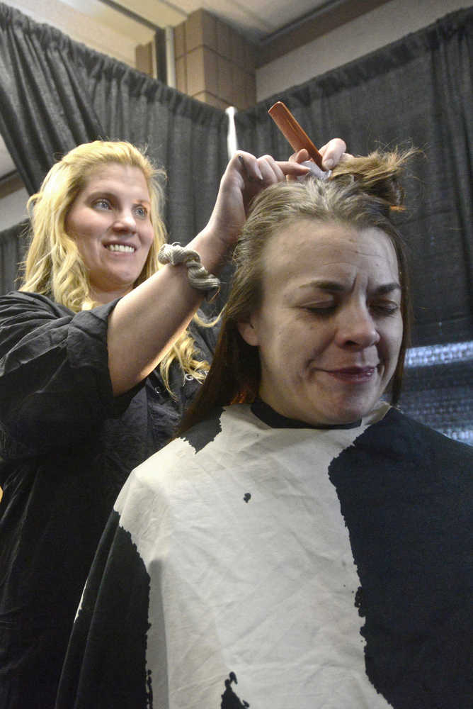 Ben Boettger/Peninsula Clarion  In this Jan. 2016 file photo, volunteer hairdresser Joy Conner (left) prepares to cut the hair of Alison Alley during Project Homeless Connect on Thursday, Jan. 28, 2016 at the Soldotna Regional Sports Complex