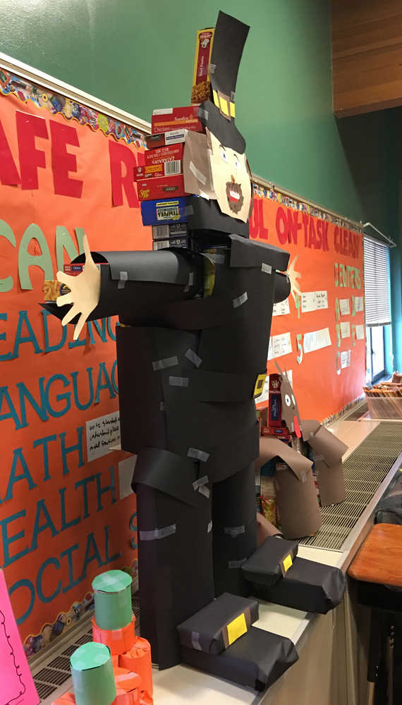 This pilgrim and turkey sculpture was created by students in Robert Stitt's class at Redoubt Elementary School in Soldotna using food items brought in by students for the school's "Canstruction" competition Thursday. Food items collected during the event will be donated to the Kenai Peninsula Food Bank. (Photo by Will Morrow/Peninsula Clarion)