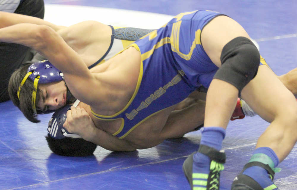 Homer's Luciano Fasulo tries to move Bethel's Carl Charlie to his back during a 126-pound match of the championship semifinal round of the Lancer Smith Memorial Friday in Wasilla. Fasulo, the top seed in the bracket, won the match 14-7.
