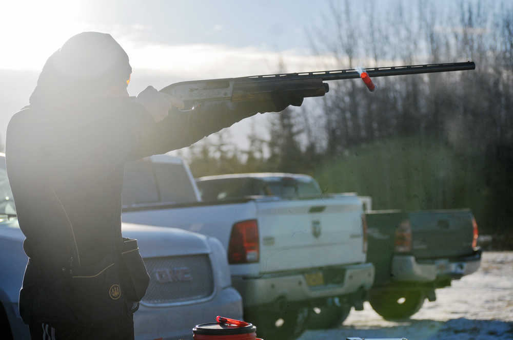 Photo by Elizabeth Earl/Peninsula Clarion Adam Trujillo lets off a shot at a pie plate for a chance at winning a turkey at the Snowshoe Gun Club on Sunday, Nov. 20, 2016 in Kenai, Alaska. The club, located on the Kenai Spur Highway between Kenai and Soldotna, hosted a series of events Sunday, including an "Annie Oakley" trap-shooting game and the pie-plate shooting. The club, which is always open for members, will host its annual membership meeting on Sunday, Dec. 3.