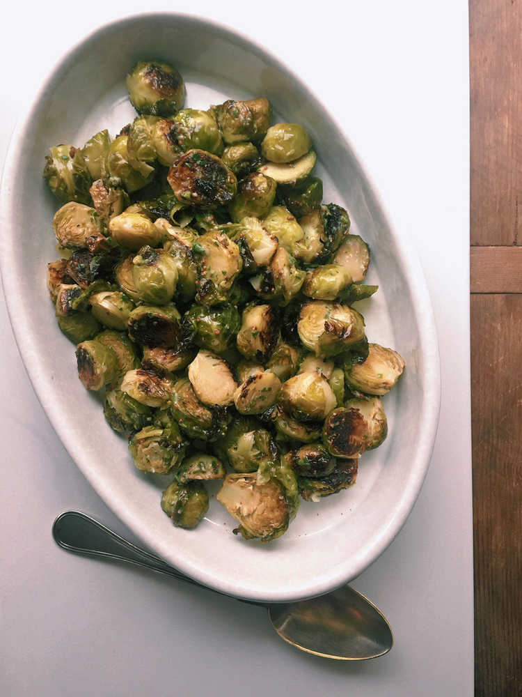 This October 2016 photo shows a warm Brussels sprouts salad with anchovy vinaigrette in New York. This dish is from a recipe by Katie Workman. (Katie Workman via AP)