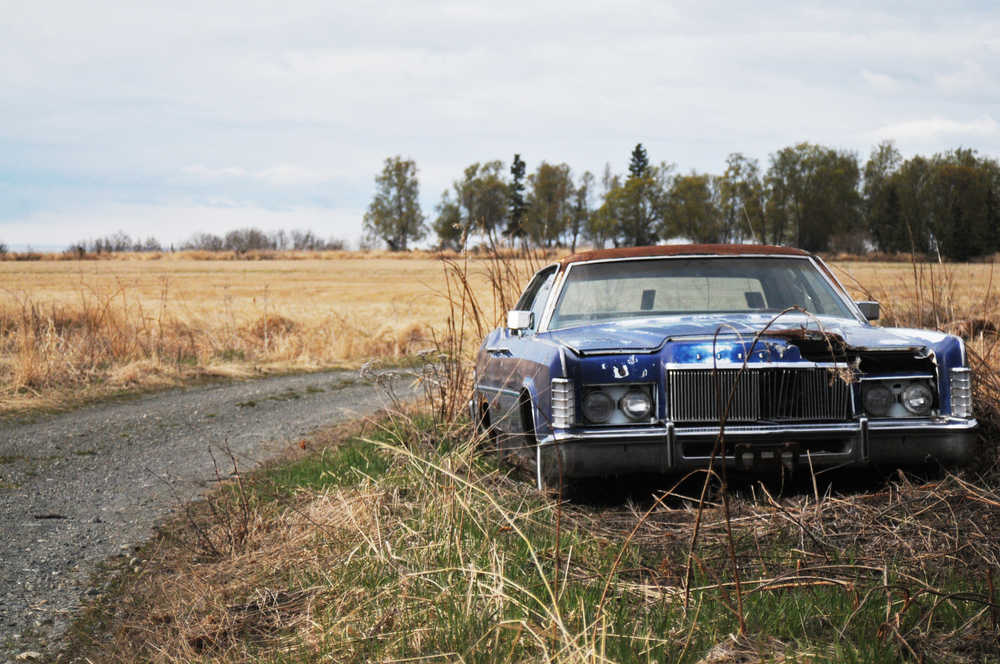 Photo by Elizabeth Earl/Peninsula Clarion In this April 29, 2016 photo, an old car is parked on the side of the road near the bluff in Clam Gulch, Alaska. The Kenai Peninula Borough Assembly passed an ordinance Nov. 22 that will allow residents to register cars at least eight years old permanently, replacing the current biennial registration system.