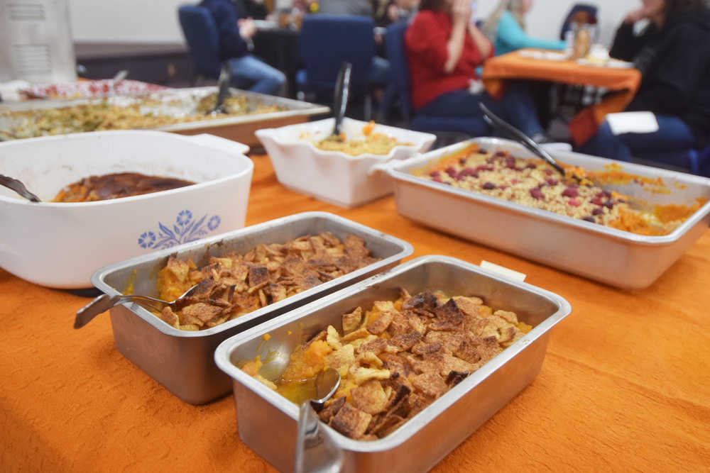 Photo by Megan Pacer/Peninsula Clarion Thanksgiving fixings from sweet potatoes and green bean casserole to pies and cobbler adorn a table during a meal provided by the Kasilof Mercantile and the the Kasilof Community Church on Thursday, Nov. 24, 2016 at the church in Kasilof, Alaska.