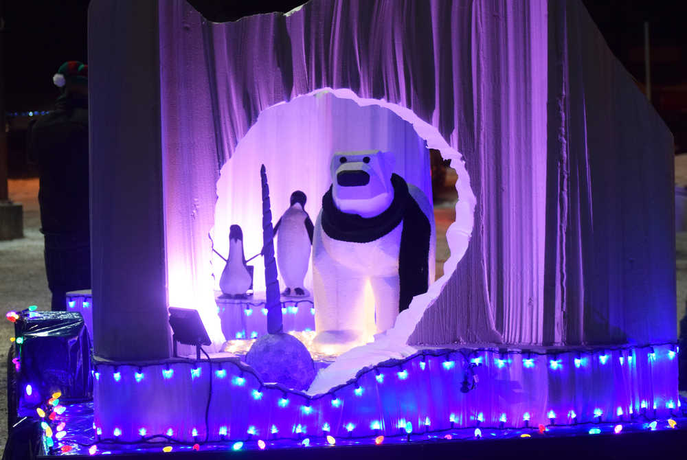 Photo by Megan Pacer/Peninsula Clarion A polar bear and pair of penguins peer out of the back of a float after making the rounds in the lights parade during this year's Christmas Comes to Kenai celebration Friday, Nov. 25, 2016 outside the Kenai Chamber of Commerce and Visitor Center in Kenai, Alaska.
