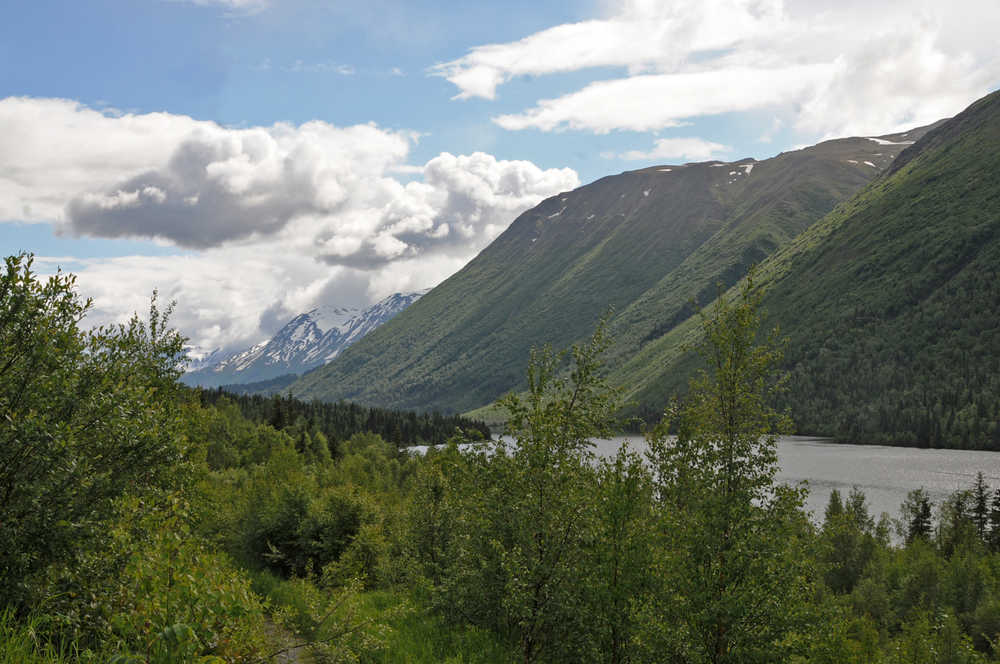 Photo by Elizabeth Earl/Peninsula Clarion In this June 2016 photo, the clouds mass over the mountains around Lower Russian Lake near Cooper Landing, Alaska. The conservation nonprofit Cook Inletkeeper recently installed a temperature sensor on the Russian River below Lower Russian Lake to keep track of the river's temperatures on a real-time basis.