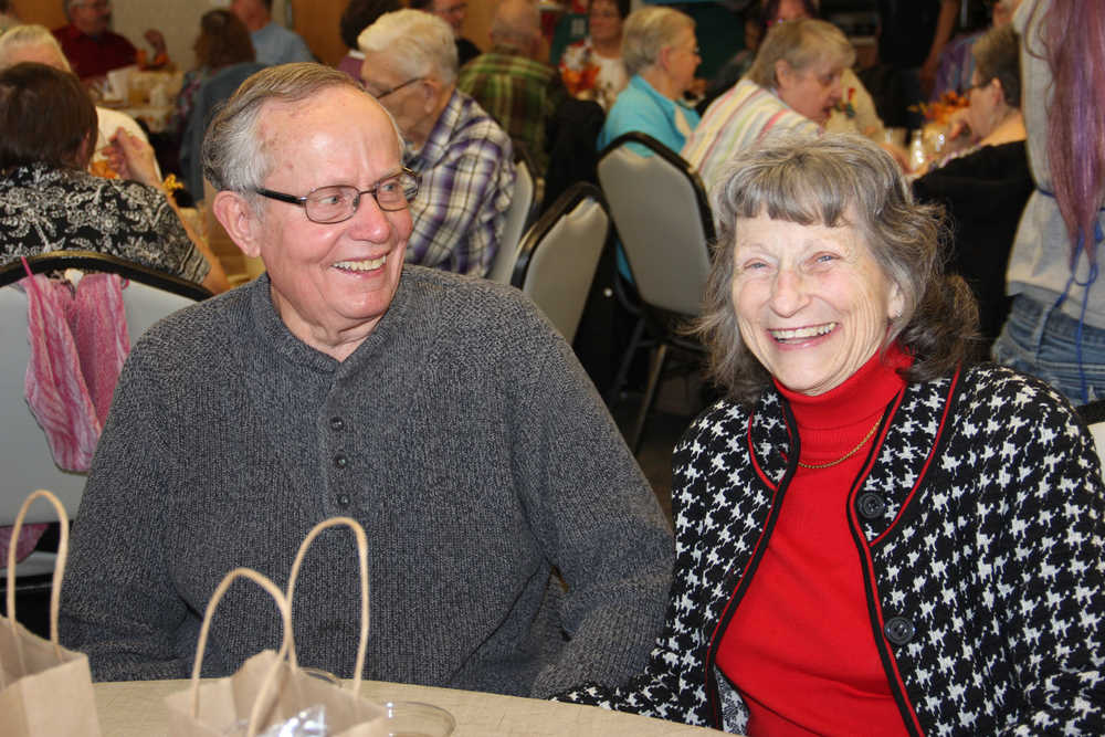 Mark and Anita Necessary share a smile at Hilcorp's early Thanksgiving dinner.