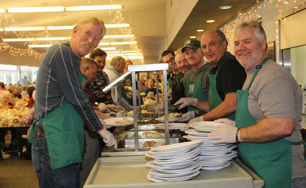 Hilcorp volunteers serve some 300 turkey dinners to Kenai Seniors.