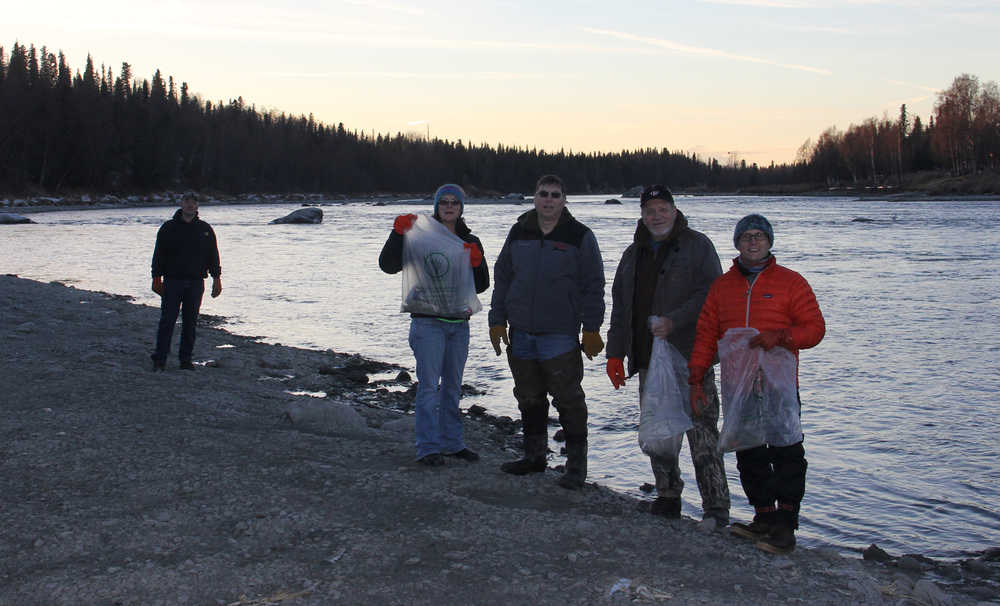 Volunteers clean up what fishers left behind at Rotary Park.