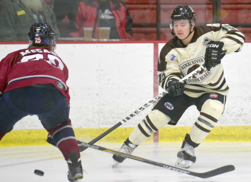 Photo by Jeff Helminiak/Peninsula Clarion Brown Bears forward Luke Radetic assists on the first goal of the game Sunday at the Soldotna Regional Sports Complex. The Brown Bears beat the Ice Dogs 6-2.