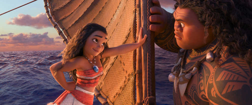 This image released by Disney shows characters Maui, voiced by Dwayne Johnson, right, and Moana, voiced by Auli'i Cravalho, in a scene from the animated film, "Moana."  (Disney via AP)