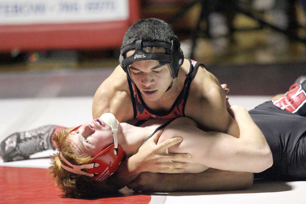 Kenai Central's Keyshawn McEnerney holds Wasilla's Andrue Shepersky to the mat during the 152-pound final of the North/South Invitational Saturday in Wasilla. McEnerney earned a 9-3 decisiion in the match.