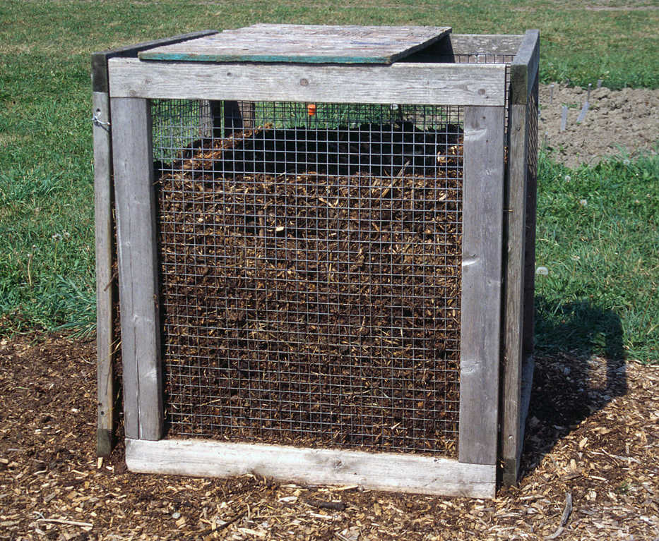 This undated photo shows a compost bin in New Paltz, N.Y. Gathering compost materials together in a bin speeds the composting process and keeps everything tidy. (Lee Reich via AP)