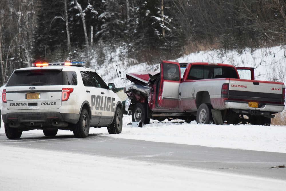 Photo by Megan Pacer/Peninsula Clarion Traffic backs up along the Sterling Highway following a two-vehicle collision Thursday, Dec. 8, 2016 near the intersection of the highway and Mackey Lake Road in Soldotna, Alaska. One person was killed in the crash and the other taken to Central Peninsula Hospital to be treated for injuries.