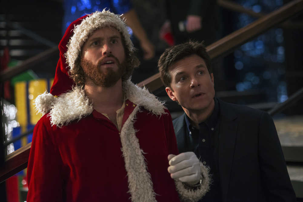 This image released by Paramount Pictures shows T.J. Miller as Clay Vanstone, left, and  Jason Bateman as Josh Parker in a scene from "Office Christmas Party." (Glen Wilson/Paramount Pictures via AP)
