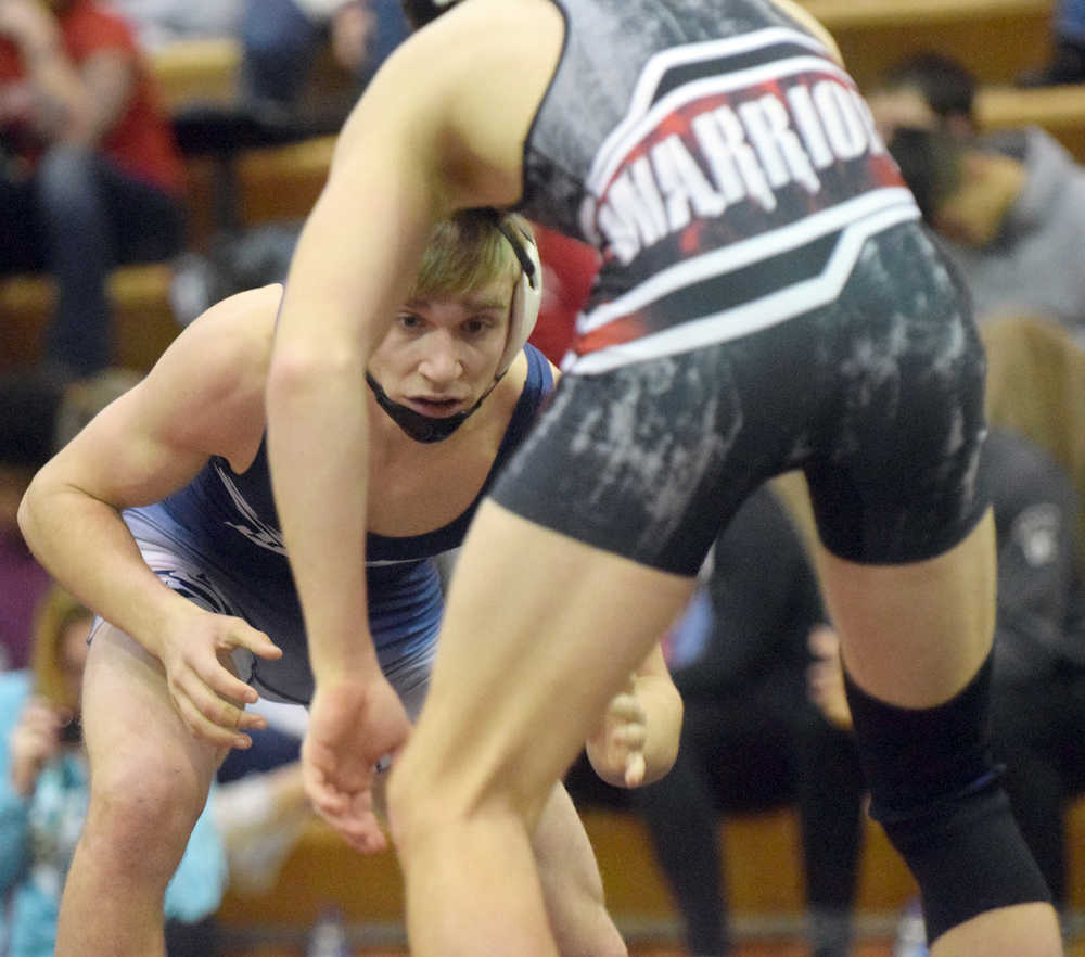 Photo by Joey Klecka/Peninsula Clarion Soldotna junior Bechler Metcalf eyes his opponent, Wasilla's Andrue Shepersky, in the 152-pound final at the Northern Lights Conference tournament Saturday, Dec. 10, at Kenai Central High School.