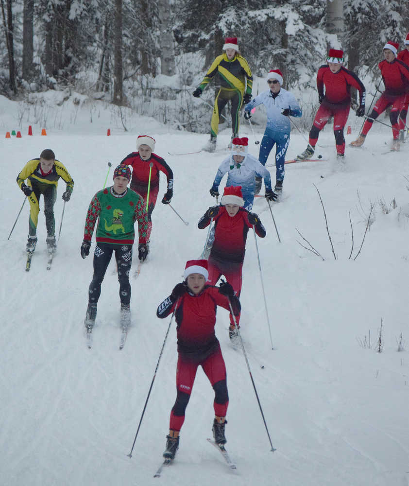 Photo by Joey Klecka/Peninsula Clarion The field of varsity boys skiers takes off in Friday's Candy Cane Scramble at the Tsalteshi ski trails in Soldotna.