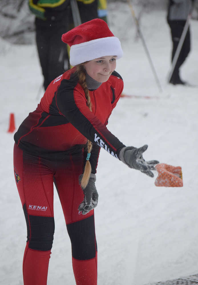 Photo by Joey Klecka/Peninsula Clarion Kenai Central skier Veronika Budyanu throws her bean bag at the targeted waste bin Friday afternoon at the Tsalteshi ski trails in Soldotna.