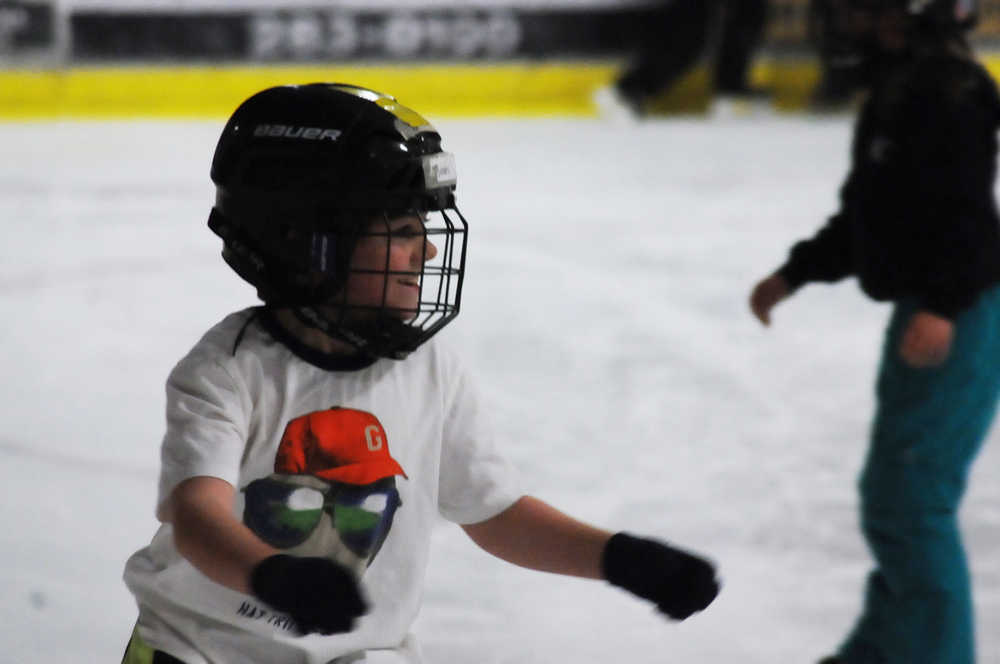 Photo by Elizabeth Earl/Peninsula Clarion Brody Linton, a student at Soldotna Montessori Charter School, skates around the ice rink during a class skating event Monday, Dec. 19, 2016 at the Soldotna Regional Sports Complex in Soldotna, Alaska. The students, some slipping and some gliding, skated around the rink for several hours Monday.