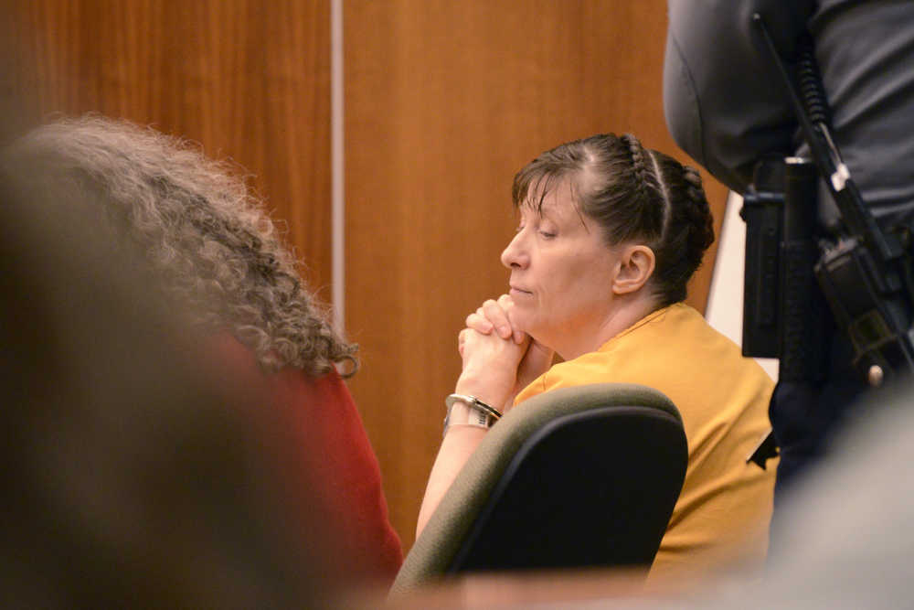 Photo by Megan Pacer/Peninsula Clarion Sterling resident Laurel Lee listens during a sentencing hearing Tuesday, Dec. 20, 2016 at the Kenai Courthouse in Kenai, Alaska. Lee was convicted of second-degree sexual abuse of a minor in May and was sentenced to five years in jail Tuesday.