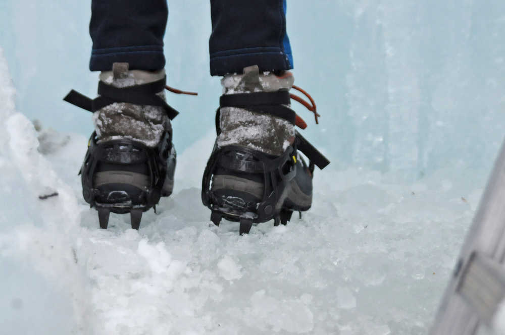 Photo by Elizabeth Earl/Peninsula Clarion Avery Walden, 9, stands before an ice wall her father set up in the back yard of their home on Sunday, Dec. 18, 2016 near Soldotna, Alaska. Her father, Chris Walden, had to custom-make her ice cleats from a larger set. "Mountaineering gear for kids doesn't exist, so a lot of times you have to fabricate stuff, weld stuff, make stuff," he said. Avery and Chris Walden, along with a family friend, will embark on an eight-day expedition to summit Mt. Kilimanjaro in Tanzania. If they succeed, Avery Walden will be the youngest female ever to summit the 19,341-foot mountain.