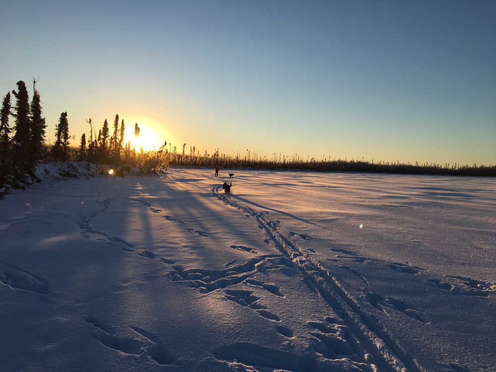 Skiers enjoy the afternoon sun low on the horizon over Bottenintnin Lake on the Kenai National Wildlife Refuge. (Photo courtesy Kenai National Wildlife Refuge)