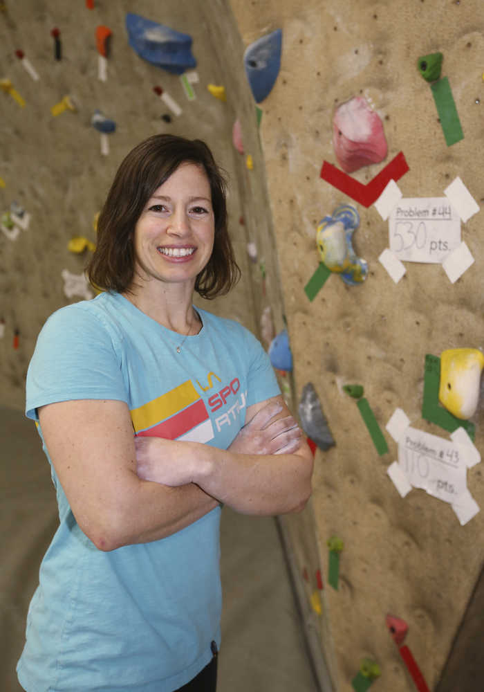 ADVANCE FOR RELEASE SATURDAY, DEC. 17, 2016 AND THEREAFTER - In this Dec. 8, 2016 photo, Emily Mengershausen poses for photos at Ascension Rock Club in Fairbanks, Alaska. Mengershausen, one of Fairbanks' premier climbing instructors, taught herself to climb and started competing after she was injured as a young gymnast. (Eric Engman/Fairbanks Daily News-Miner via AP)
