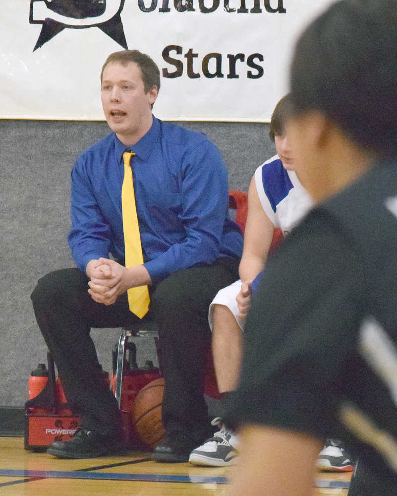 Photo by Joey Klecka/Peninsula Clarion First-year Cook Inlet Academy boys head coach Ryan McMilin keeps a close eye on the action, Dec. 15, at the CIA Classic Tournament in Soldotna.