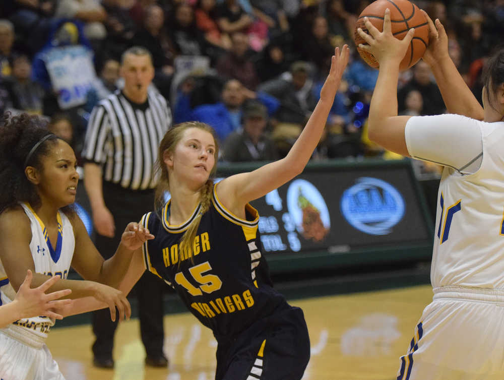 Photo by Joey Klecka/Peninsula Clarion Homer guard Alyssa Cole (15) battles to block the Barrow Whalers in the Class 3A girls state championship game, Saturday Mar. 26, at the Alaska Airlines Center in Anchorage.