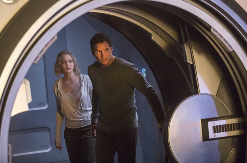 This image released by Columbia Pictures, Jennifer Lawrence, left, and Chris Pratt in a scene from the film, Passengers." (Jaimie Trueblood/Columbia Pictures/Sony via AP)