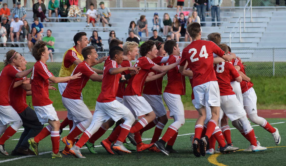 Photo by Joey Klecka/Peninsula Clarion The Kenai Central boys soccer team celebrates its semifinal victory over Service, May 27 at the state soccer championships at Service High School.