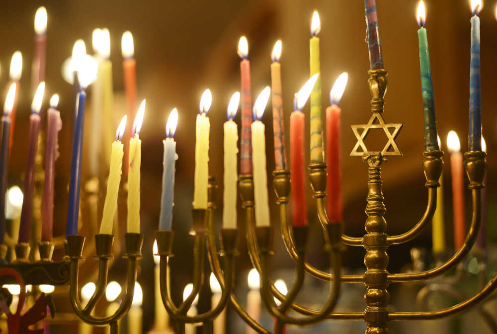 Ben Boettger/Peninsula Clarion Menorah candles glow for Hanukkah, lit by members of the Kenai Peninsula's Briat Elohim Jewish congregation in a celebration at the home of member Allison Gottesman on Friday, Dec. 30 near Kenai. This past Sunday was the final day of Hanukkah.