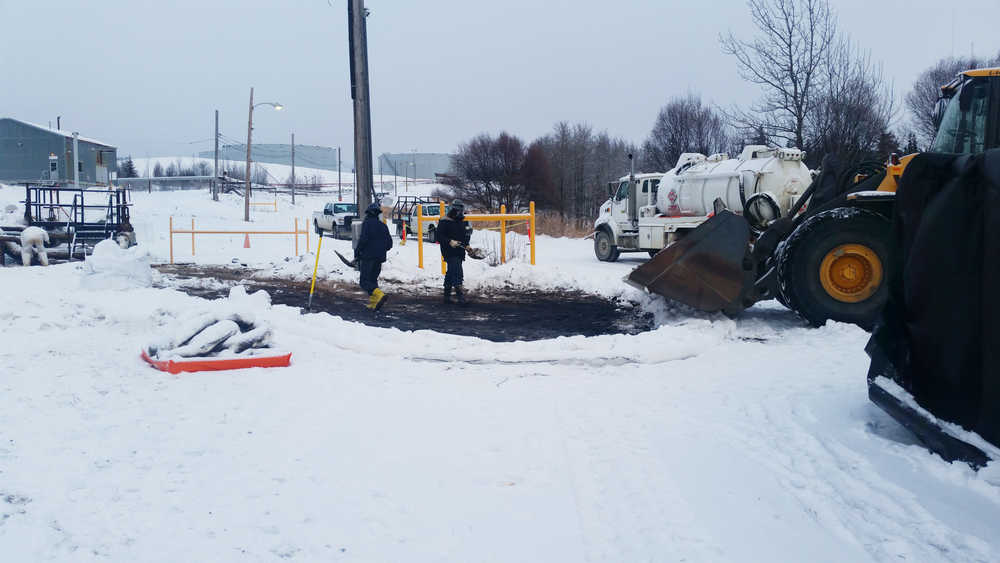 Photo courtesy the Alaska Department of Environmental Conservation Workers respond to a spill of mixed crude oil and water near the Tesoro Refinery on Tuesday, Dec. 20, 2016 in Nikiski, Alaska. The facility operator discovered the spill Dec. 18 and reported it to the Department of Environmental Conservation. The cause is still under investigation.