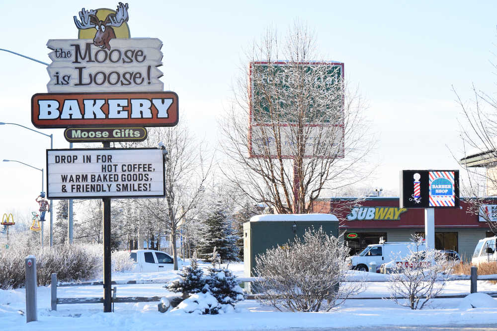 Photo by Megan Pacer/Peninsla Clarion Signs for various businesses line the Sterling Highway on Thursday, Jan. 5, 2017 in Soldotna, Alaska. City staff in Soldotna have begun the process to revise the town's sign code, which could mean a few changes down the road for business owners.