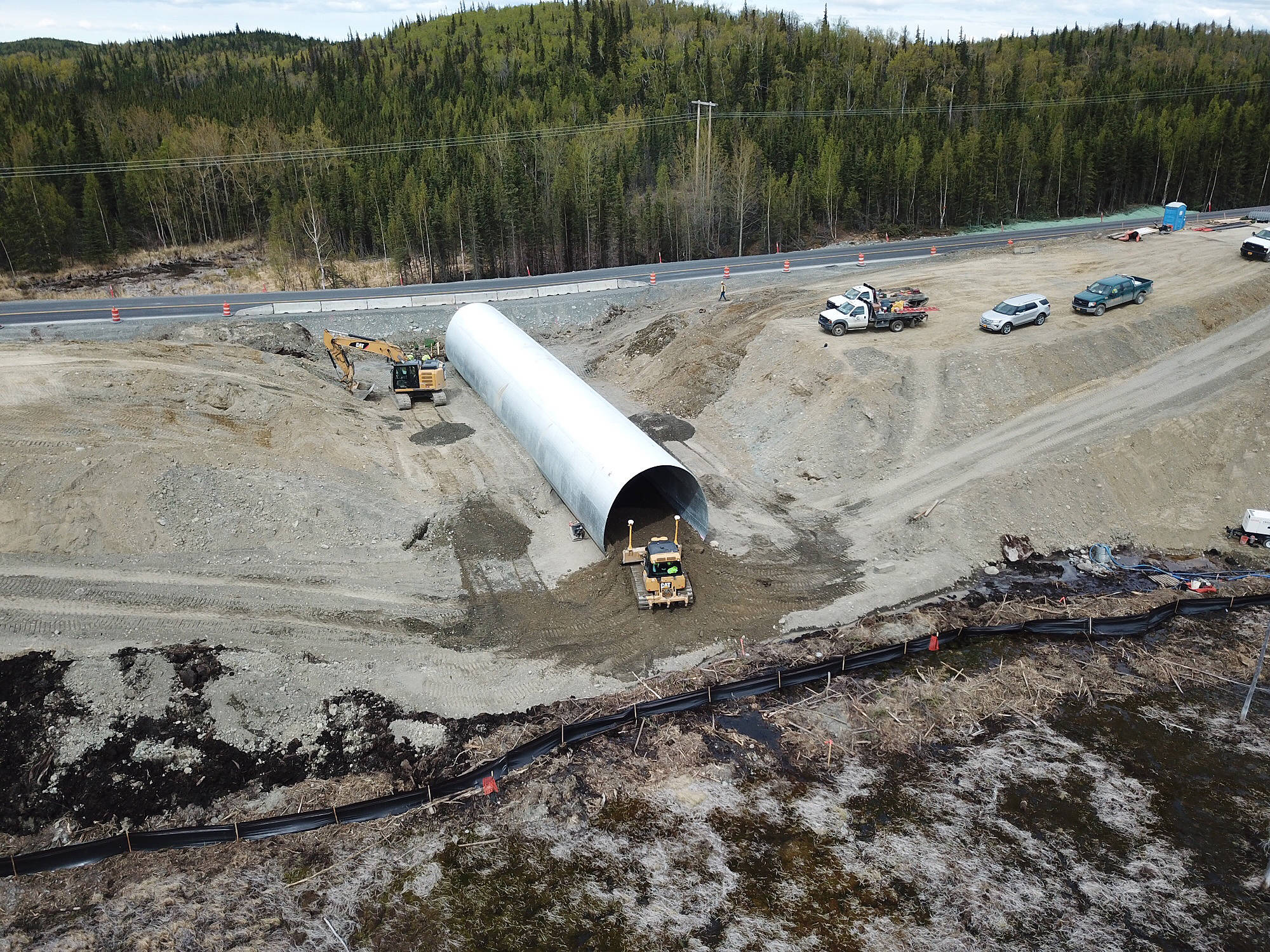 An aerial photo of the longest of five culverts being installed under the Sterling Highway. (Photo by Shaun Combs, DOT&PF)