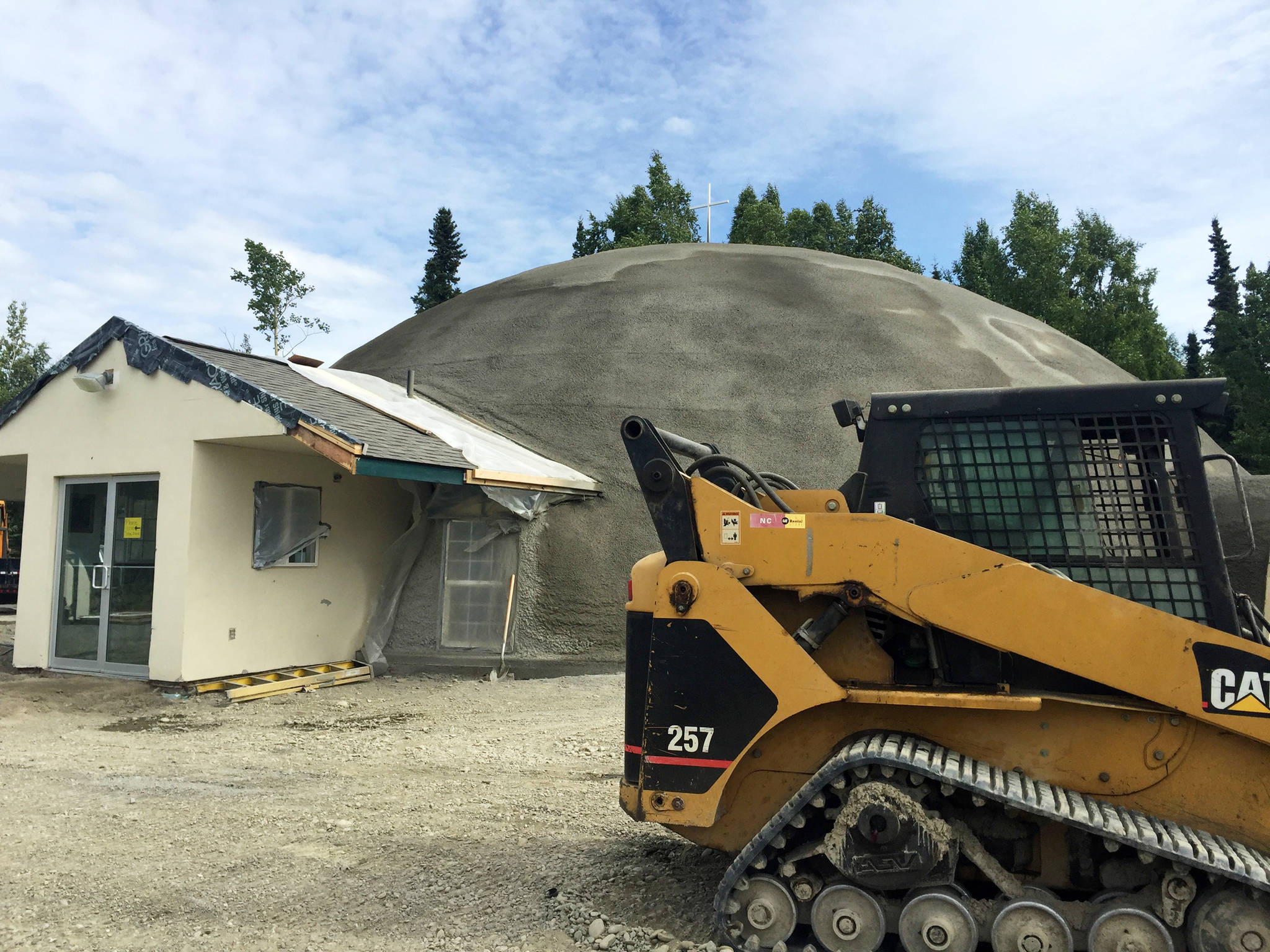 Construction equipment sits among dirt piles outside the Trinity Christian Center on Monday, Aug. 6, 2018 near Soldotna. (Photo by Elizabeth Earl/Peninsula Clarion)