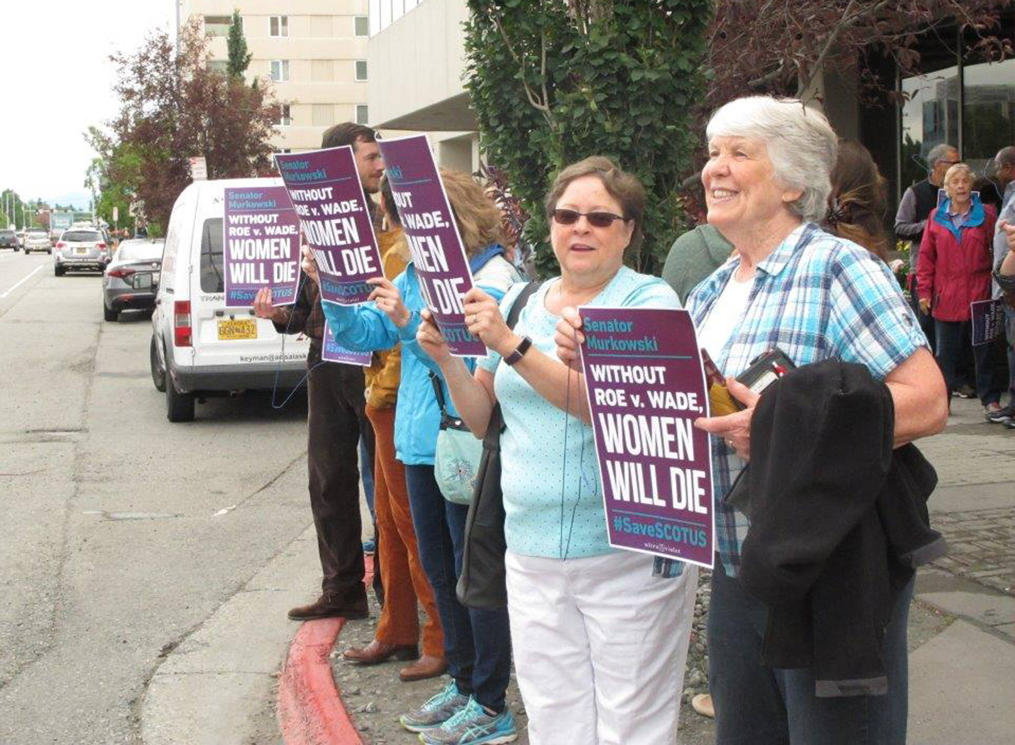 Carole Shay, right, and Gwen Helms participate in a protest outside U.S. Sen. Lisa Murkowski’s office Monday, July 9, 2018, in Anchorage, Alaska. Protesters rallied to urge Murkowski to vote against President Donald Trump’s Supreme Court nominee. (AP Photo/Rachel D’Oro)