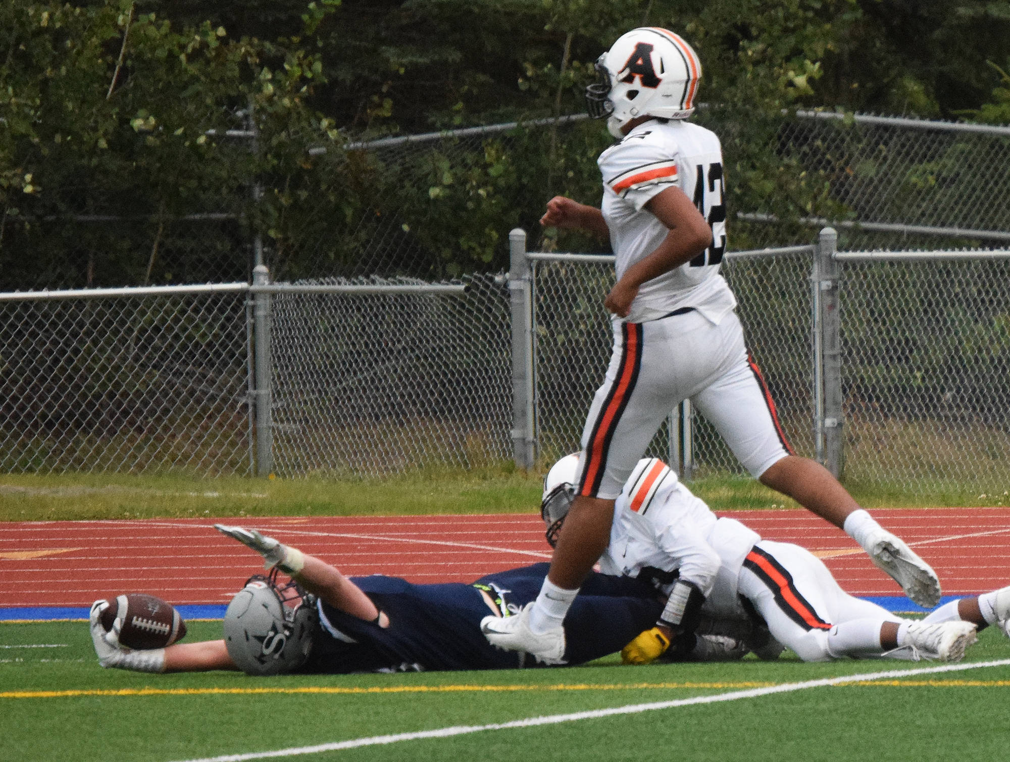 Galen Brantley III celebrates a touchdown on the turf Friday against West Anchorage at Justin Maile Field in Soldotna. (Photo by Joey Klecka/Peninsula Clarion)