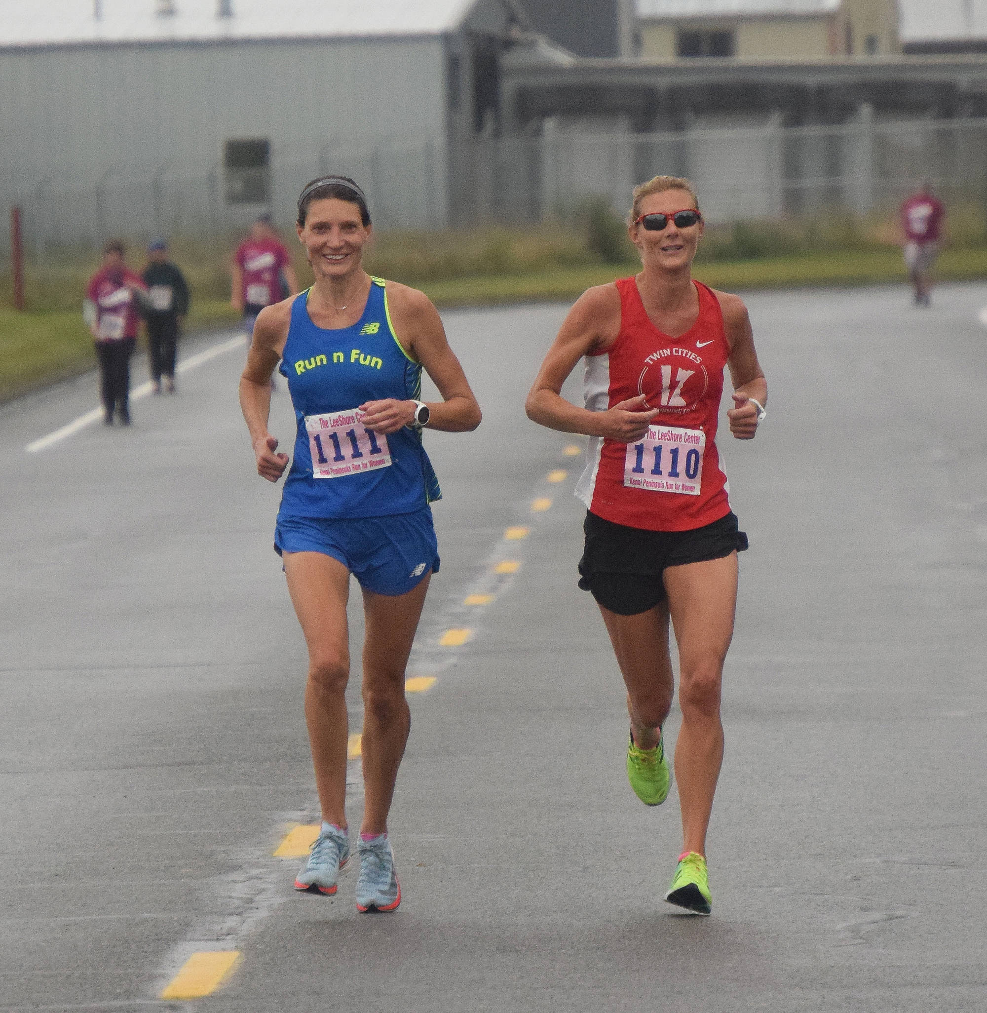 Angie Voight (left) and Casey Schwarz approach the finish of the women’s 10K race Saturday morning in the 31st annual LeeShore Center Run for Women in Kenai. (Photo by Joey Klecka/Peninsula Clarion)